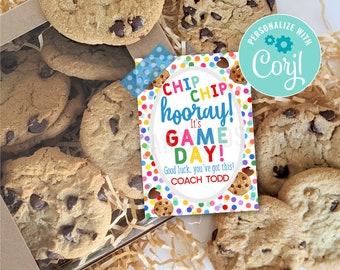 May include: A colorful printable gift tag with the text "Chip Chip Hooray! It's Game Day! Good luck, you've got this! Coach Todd" and a background of colorful polka dots. The tag is sitting on top of a box of chocolate chip cookies.