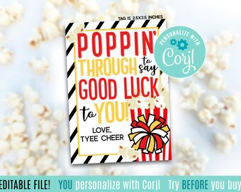 May include: A rectangular gift tag with the text "POPPIN' THROUGH to say GOOD LUCK to YOU!" in red and yellow. The tag includes a popcorn graphic and a pom-pom design. The tag is 2.5 x 3.5 inches.