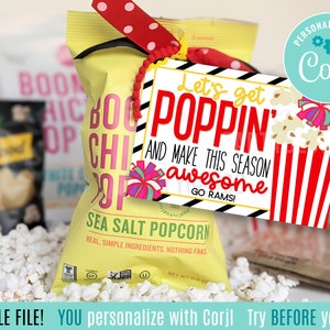 May include: A printable gift tag with a red and white striped popcorn bucket and the text "Let's get poppin' and make this season awesome! Go Rams!"  The tag is tied to a bag of sea salt popcorn with a red and white ribbon.