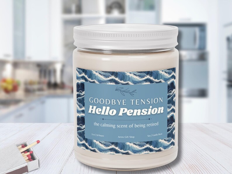 May include: A cream-colored candle in a glass jar with a white lid. The label reads "Goodbye Tension, Hello Pension" with a blue wave design. The candle is 9 oz and has a soy and vanilla bean scent.