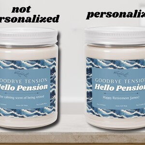 May include: Two white jar candles with white lids. The labels read "Goodbye Tension Hello Pension" with the phrase "the calming scent of being retired" on one and "Happy Retirement James!" on the other. The labels have a blue wave design.