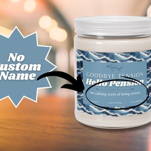 May include: A white jar candle with a white lid. The label features a blue wave design and text that reads "Goodbye Tension, Hello Pension" and "the calming scent of being retired."