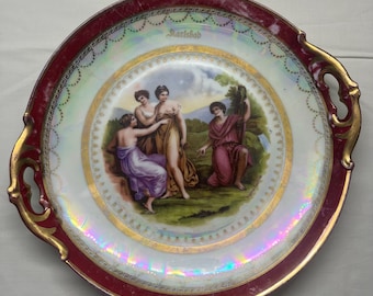 Antique porcelain gold-plated plate with handles 1909-1922.