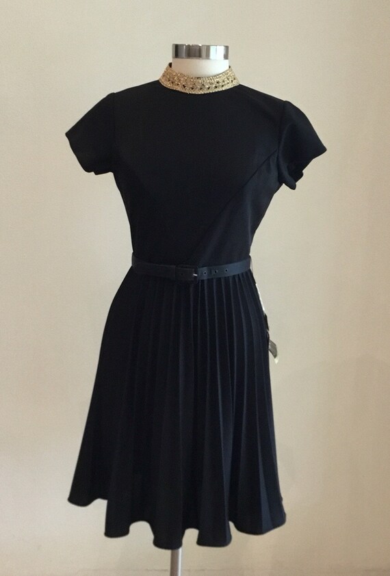 black dress with gold embellishment