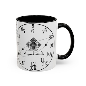 May include: White ceramic mug with a black interior and handle. The mug features a clock face design with a central emblem and stylized numerals. The design is in black and white.