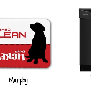 May include: A white and red dishwasher magnet with a black silhouette of a dog. The magnet says "Washed Clean" and "Licked Clean" with the word "Clean" in red. The dog is sitting with its head tilted up. The magnet is labeled "Murphy".