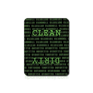 May include: Black and green dishwasher magnet with the words "CLEAN" and "DIRTY" in green, surrounded by a matrix of green binary code. The magnet is rectangular with rounded corners.