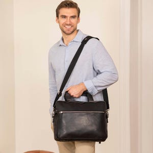 Maletín de cuero negro con compartimentos organizados: ideal para negocios, oficina y viajes