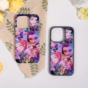 May include: Two phone cases with a collage design featuring animated female characters in shades of purple, pink, and blue. One case has a clear background, while the other has a dark gray border.