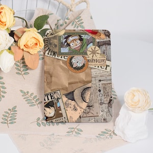 May include: A brown and beige collage featuring a cartoon character with a straw hat and goggles. The collage includes text that says "WANTED DEAD OR ALIVE" and "MONKEY D. LUFFY 300,000,000".