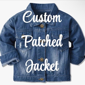 May include: A blue denim jacket with distressed details and the text "Custom Patched Jacket" in white.