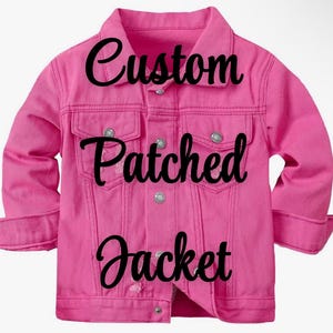May include: A pink denim jacket with the text "Custom Patched Jacket" in black lettering.
