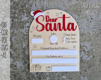 May include: A wooden sign with a red "Dear Santa" title and blank spaces for a child to fill in their age, Christmas wishes, and favorite things about Christmas. The sign is decorated with stars and a Santa hat.