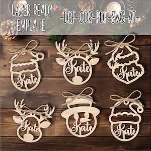 Peut inclure: Six décorations en bois découpées au laser avec le nom "Kate" inscrit sur chacune. Les décorations sont en forme de renne, de bonhomme de neige, de chapeau de Père Noël et de sapin de Noël. Les décorations sont prêtes à être personnalisées.