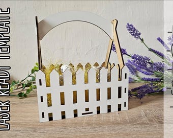 May include: White wooden basket with a picket fence design and a handle. The basket is filled with straw and has a white picket fence design. The basket is on a wooden surface. -DXF -CDR -PDF -SVG -AI