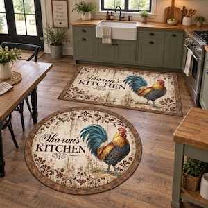 May include: Two kitchen floor mats with a rustic wood-plank design, one rectangular and one circular. Both feature a colorful rooster illustration, decorative scrollwork borders, and the printed text "Sharon's KITCHEN" in a dark script font.