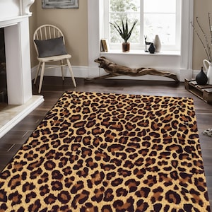 May include: A brown and tan leopard print area rug with a soft, fuzzy texture. The rug is perfect for adding a touch of wild style to any room.