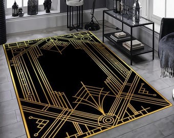 May include: A rectangular area rug featuring a bold black background with intricate, symmetrical gold geometric lines and patterns. The design consists of sharp angles, straight borders, and circular motifs that create a structured, linear layout.