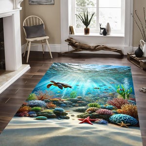 May include: A colorful underwater rug with a sea turtle swimming over coral reefs and fish. The rug has a sandy beach at the bottom and blue water with sunbeams shining through.