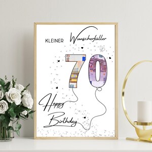 以下が含まれることがあります： 「Happy Birthday」と「Kleiner Wunscherfüller」の文字が筆記体で書かれた額入りのプリント。数字の70は風船としてデザインされており、数字はユーロ紙幣の画像で埋められています。背景は白です。