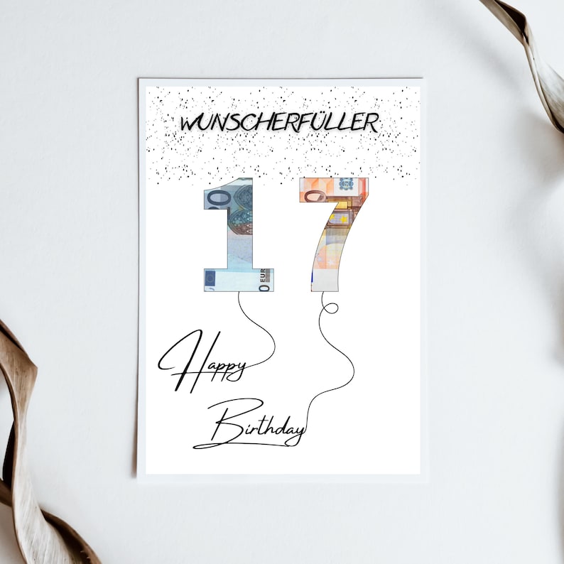 May include: A white card with black text that says "Wunschersch&uuml;ller" and "Happy Birthday". The number 17 is made of euro bills and is floating like balloons.