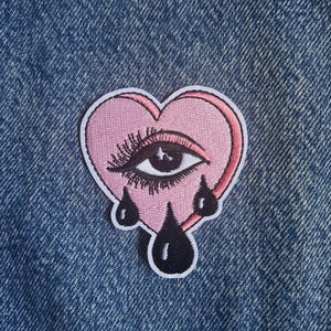 Teary Eyed Embroidered Iron-On Patch - Pink Heart Crying Pop Art Motif Applique Sew
