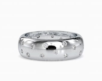 May include: A silver band ring with a polished finish and a scattered pattern of small round diamonds.