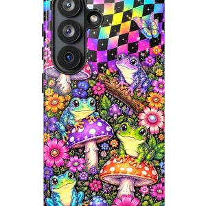 May include: A smartphone case featuring a vibrant, psychedelic design with a rainbow-coloured checkerboard pattern at the top, multiple colourful frogs, various mushrooms in shades of purple and orange, and bright pink, yellow, and blue flowers.