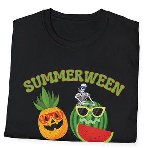 May include: Black t-shirt with the word "SUMMERWEEN" in green and orange lettering. The shirt features a pineapple and watermelon with sunglasses and a skeleton wearing sunglasses and a hat.