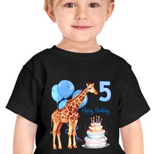 May include: Black t-shirt featuring a watercolor design for a fifth birthday. The design includes a giraffe, blue balloons, a tiered cake with candles, and the text "Happy Birthday" and the number "5".