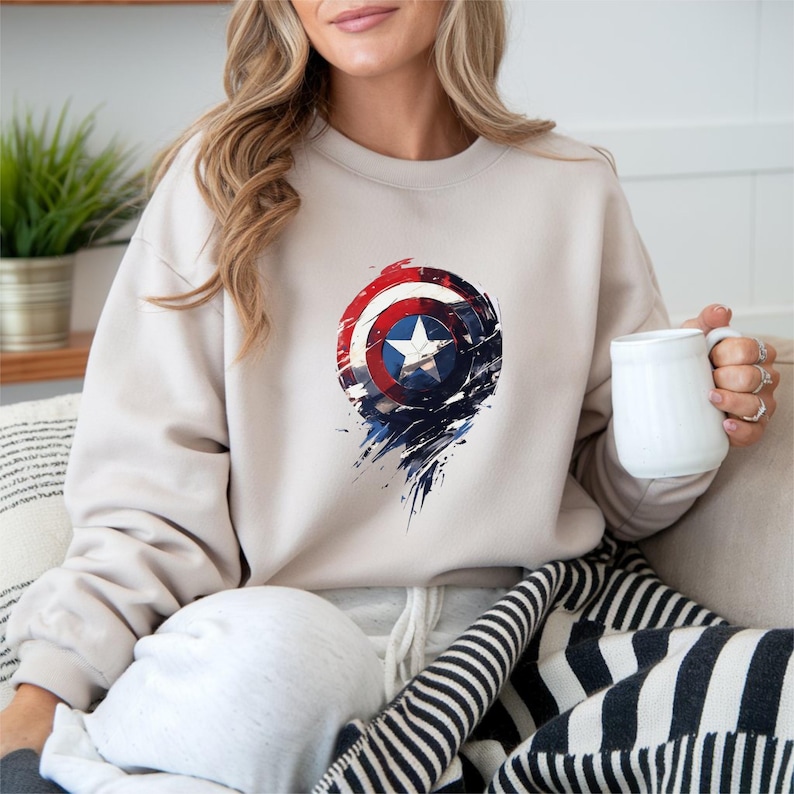 a woman sitting on a couch holding a cup of coffee
