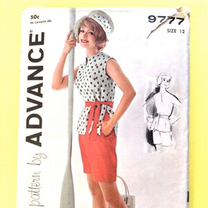 May include: Advance sewing pattern 9777 size 12 featuring a sleeveless top with a small dark pattern, a solid red waist tie, and matching red shorts. The envelope displays the text ADVANCE, 9777, SIZE 12, and 50c. A sketch of the outfit is included.