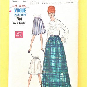 May include: Vintage Vogue pattern featuring illustrations of skirts and a blouse. The pattern includes sizing information for a 24-inch waist and 34.5-inch hips. The price is 75 cents, and 85 cents in Canada. The pattern is marked "NEW Sizing."