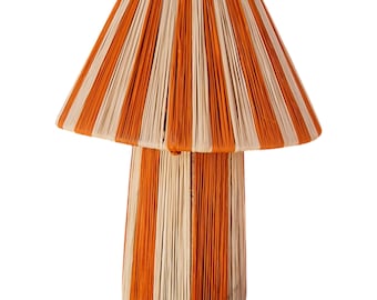 May include: A striped orange and cream table lamp with a mushroom-shaped shade. The lamp is made of woven material.