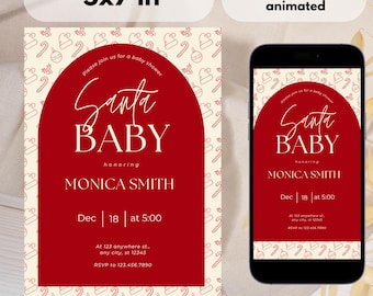Peut inclure: Une invitation de baby shower sur le thème de Noël avec un design en arche rouge et les mots "Santa Baby" en écriture élégante. L'invitation mesure 12,7 x 17,8 cm et comprend les détails de la baby shower de Monica Smith le 18 décembre.