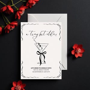 May include: A black and white illustration of a martini glass with olives and a black ribbon. The text "a tiny bit older" is above the glass. The text "LET'S DRINK TO MONICA'S 30TH" is below the glass, along with the date, time, and address for the event.