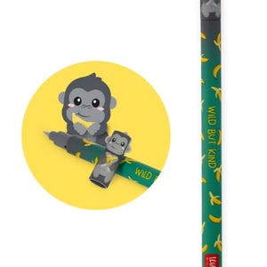 May include: A green pen featuring a repeating yellow banana pattern and the text "WILD BUT KIND" printed on the barrel. The pen cap is topped with a small gray gorilla figure holding a banana, and the base includes a small white eraser tip.