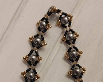 Elegant silver, gold and black bracelet