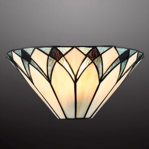 May include: A semi-circular wall lamp shade constructed from stained glass panels. The design features a repeating petal-like pattern in cream, light blue, and dark purple glass, all held together by dark metal soldering lines in a geometric layout.