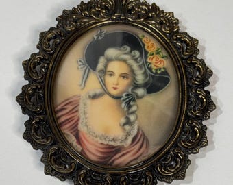 Vintage ornate oval metal frame with convex glass and beautiful portrait print of woman, ready to hang with plum-colored felt backing