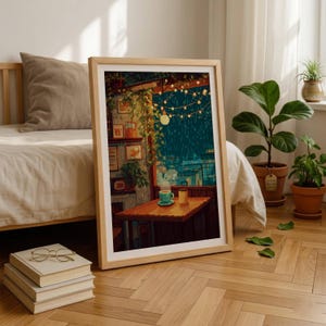 May include: A framed art print featuring a digital illustration of a cozy indoor scene with a wooden table, a teal cup, and a yellow mug. The background shows a rainy night view through a window with hanging string lights and lush green plants.