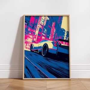 May include: A framed art print featuring a stylized sports car speeding down a city street. The artwork uses a vibrant color palette of blue, pink, and yellow, with a focus on the car's sleek design and the urban backdrop.