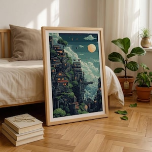 May include: A framed vertical art print featuring a pixel art landscape of a multi-level cliffside village nestled among lush green trees and clouds under a pale moon, displayed in a light wood frame on a wooden floor near a bed.