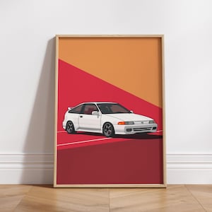 May include: A framed art print featuring a white Honda CRX hatchback with dark wheels, positioned on a diagonal background split between orange and red sections. The car is depicted in a clean, graphic style with a rear spoiler and orange turn signals.