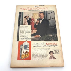 May include: Vintage magazine advertisement for Camel cigarettes featuring Dick Powell. The ad includes a photo of Powell and a pack of Camel cigarettes. Text promotes the brand's flavor and popularity.