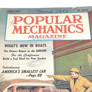 May include: A vintage cover of Popular Mechanics Magazine from March 1954. The cover features a red car with a white top, a man pointing, and the magazine title in large red letters. Text includes "What's New in Boats" and "America's Smallest Car."