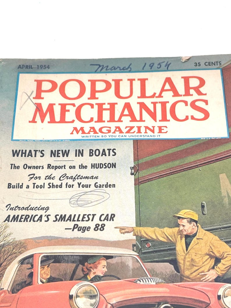 May include: A vintage cover of Popular Mechanics Magazine from March 1954. The cover features a red car with a white top, a man pointing, and the magazine title in large red letters. Text includes "What's New in Boats" and "America's Smallest Car."