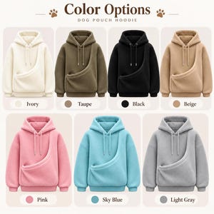 May include: A collection of seven dog pouch hoodies displayed in ivory, taupe, black, beige, pink, sky blue, and light gray. Each hoodie features a hood with drawstrings and a large front pouch pocket. The text Color Options and Dog Pouch Hoodie is visible.