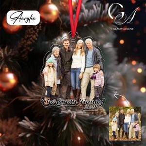 May include: Acrylic Christmas ornament featuring a family photo. The ornament has a red ribbon for hanging and includes the text "The Smith Family 2024". The word "Acrylic" is also visible.