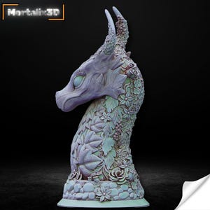 May include: A detailed sculpture of a dragon's head and neck, adorned with floral and leaf patterns. The dragon is primarily a pale lavender color, with green and pink accents. The base features a stone-like texture. The text "Mortalix3D" is in the upper left corner.